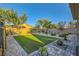 Well-maintained backyard featuring artificial turf and brick paver patio, perfect for outdoor enjoyment at 7702 Wishbone Falls St, North Las Vegas, NV 89084