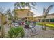 Charming backyard featuring a cozy fire pit, beautiful landscaping and a view of the home at 7702 Wishbone Falls St, North Las Vegas, NV 89084
