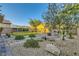 Relaxing backyard featuring mature landscaping, a fire pit sitting area and comfortable garden at 7702 Wishbone Falls St, North Las Vegas, NV 89084