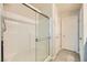 Bathroom featuring a clear glass shower and natural light at 7702 Wishbone Falls St, North Las Vegas, NV 89084