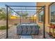 Private hot tub on a brick patio with a pergola, perfect for relaxation and outdoor enjoyment at 7702 Wishbone Falls St, North Las Vegas, NV 89084
