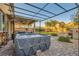Relaxing hot tub on a brick patio, with a covered pergola and landscaped backyard at 7702 Wishbone Falls St, North Las Vegas, NV 89084