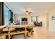 Bright and airy living room, featuring tile flooring, ample natural light, and modern furnishings at 7702 Wishbone Falls St, North Las Vegas, NV 89084