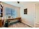 Bright home office featuring a sleek wooden desk and neutral decor at 7702 Wishbone Falls St, North Las Vegas, NV 89084
