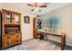 Home office space with a large desk, cabinets, and shelves for storage and organization at 7702 Wishbone Falls St, North Las Vegas, NV 89084