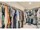 Spacious walk-in closet with plentiful hanging racks and shelves for organized storage at 7702 Wishbone Falls St, North Las Vegas, NV 89084