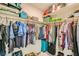 Organized walk-in closet features ample hanging space, shelving and storage, ready for all seasons at 7702 Wishbone Falls St, North Las Vegas, NV 89084