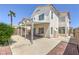 View of home's backyard, showcasing the covered patio and the surrounding landscape at 7977 Blue Brook Dr, Las Vegas, NV 89147