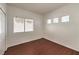This bedroom is bright, featuring modern wood floors and a window with pleasant views at 7977 Blue Brook Dr, Las Vegas, NV 89147