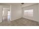 Dining room features tile flooring and natural light from the window and sliding glass doors at 7977 Blue Brook Dr, Las Vegas, NV 89147