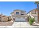 Charming two-story home with a tile roof and stone accents, plus a two-car garage and low-maintenance landscaping at 7977 Blue Brook Dr, Las Vegas, NV 89147