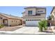 Charming two-story home with a tile roof and stone accents, plus a two-car garage and low-maintenance landscaping at 7977 Blue Brook Dr, Las Vegas, NV 89147
