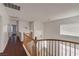 Upstairs landing with wood floors and natural light from several windows at 7977 Blue Brook Dr, Las Vegas, NV 89147