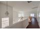 Bright upstairs landing featuring wood floors and natural light at 7977 Blue Brook Dr, Las Vegas, NV 89147