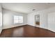 Spacious living room featuring stylish flooring, abundant natural light and easy access to other rooms at 7977 Blue Brook Dr, Las Vegas, NV 89147