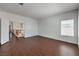 Spacious living room featuring stylish flooring, abundant natural light and easy access to other rooms at 7977 Blue Brook Dr, Las Vegas, NV 89147