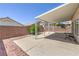 Spacious covered patio area, ideal for outdoor entertaining and relaxation at 7977 Blue Brook Dr, Las Vegas, NV 89147