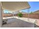 Covered patio with concrete flooring and decorative metal supports, perfect for outdoor relaxation at 7977 Blue Brook Dr, Las Vegas, NV 89147