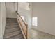 Carpeted stairway leading to the front door and upper level at 7977 Blue Brook Dr, Las Vegas, NV 89147