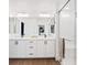 Beautiful bathroom with double sinks, quartz countertops and glass enclosed shower at 8055 Haywood Estate Ave, Las Vegas, NV 89113
