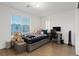 Bright bedroom features a twin bed, desk area, and natural light from the window at 8055 Haywood Estate Ave, Las Vegas, NV 89113