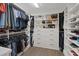Spacious walk-in closet with custom shelving, hanging rods, and ample storage space at 8055 Haywood Estate Ave, Las Vegas, NV 89113