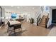 Open floor plan showcasing a modern kitchen, dining area, and staircase at 8055 Haywood Estate Ave, Las Vegas, NV 89113
