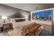 Beautiful bedroom featuring a king bed, ensuite bathroom and large view windows at 8055 Haywood Estate Ave, Las Vegas, NV 89113