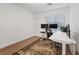 Bright home office features a large window, modern desk and decorative rug at 8055 Haywood Estate Ave, Las Vegas, NV 89113