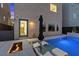 Backyard oasis showcasing a modern pool, fire pit, in-pool seating, and seamless integration with the home's architecture at 8055 Haywood Estate Ave, Las Vegas, NV 89113
