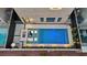 Aerial view of a backyard pool and firepit area with modern design, perfect for relaxation and entertaining at 8055 Haywood Estate Ave, Las Vegas, NV 89113