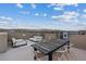 Spacious rooftop deck offering comfortable seating and dining areas with panoramic views, ideal for outdoor relaxation at 8055 Haywood Estate Ave, Las Vegas, NV 89113