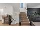 Modern staircase with wood treads, iron railings, and plenty of natural light at 8055 Haywood Estate Ave, Las Vegas, NV 89113