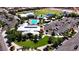 Aerial view of a community center with a pool, park, and parking at 8131 Skye Plum St, Las Vegas, NV 89166