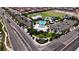 Aerial view of a community park featuring a pool, playground, and sports field at 8131 Skye Plum St, Las Vegas, NV 89166