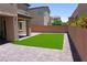 Spacious green backyard with turf and hardscape near the house at 8131 Skye Plum St, Las Vegas, NV 89166