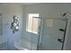 Modern bathroom showcasing a shower and bathtub combo with bright lighting at 8131 Skye Plum St, Las Vegas, NV 89166