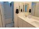 Clean bathroom featuring double vanity, shower-tub combo, and modern fixtures at 8131 Skye Plum St, Las Vegas, NV 89166