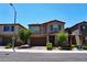 Traditional-style home featuring desert landscaping, a two-car garage, and convenient street parking at 8131 Skye Plum St, Las Vegas, NV 89166