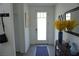 Inviting foyer with tile flooring, front door, and stylish decorations at 8131 Skye Plum St, Las Vegas, NV 89166