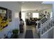 Bright foyer with wood-look tile flooring, staircase, and decorative accents at 8131 Skye Plum St, Las Vegas, NV 89166