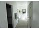 Hallway with tile flooring, white walls, and access to various rooms at 8131 Skye Plum St, Las Vegas, NV 89166
