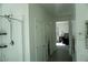 Bathroom with walk-in shower is located at the end of the hallway at 8131 Skye Plum St, Las Vegas, NV 89166