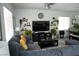 Cozy living room with neutral paint, ceiling fan, and comfortable furnishings at 8131 Skye Plum St, Las Vegas, NV 89166