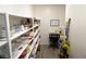 Well-organized pantry shelves with ample storage space and a convenient desk area at 8131 Skye Plum St, Las Vegas, NV 89166