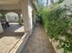 The backyard has a tile patio, an arched colonnade, and climbing plants at 8337 Ruby Heights Ave, Las Vegas, NV 89117