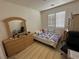 Inviting bedroom with a comfortable bed, dresser, and shuttered windows at 8337 Ruby Heights Ave, Las Vegas, NV 89117