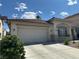 Well-maintained home featuring a two-car garage, tile roof, and easy to care for front yard at 8337 Ruby Heights Ave, Las Vegas, NV 89117