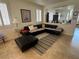 Spacious living room featuring a comfortable sectional sofa and seamless flow into the dining area at 8337 Ruby Heights Ave, Las Vegas, NV 89117