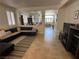 Open-concept living room seamlessly connecting to the dining area, creating an inviting space at 8337 Ruby Heights Ave, Las Vegas, NV 89117